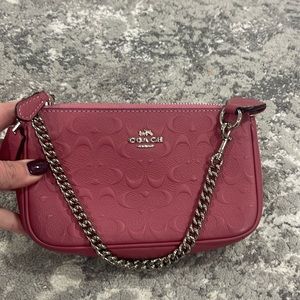 Mini pink purse from Coach.